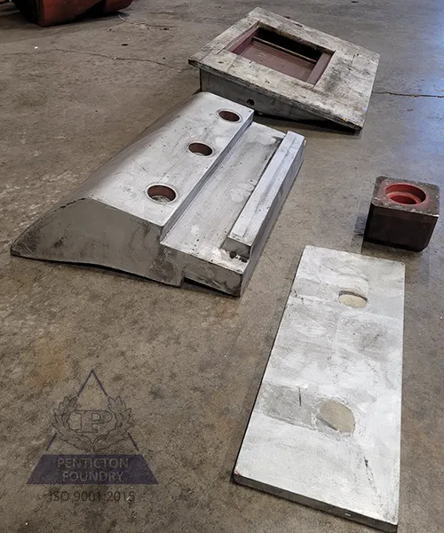 A bucket lip guard made in ASTM A532 Class 1 Type A Ni-Hard 1
