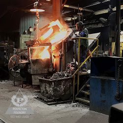 A worker pours ductile iron, ASTM A536