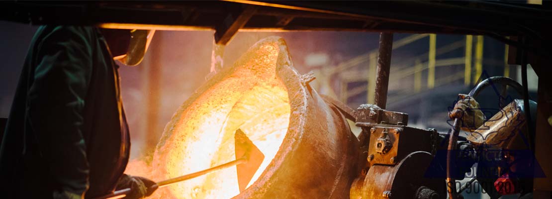 A foundry worker pours chrome white iron, one of many iron alloys