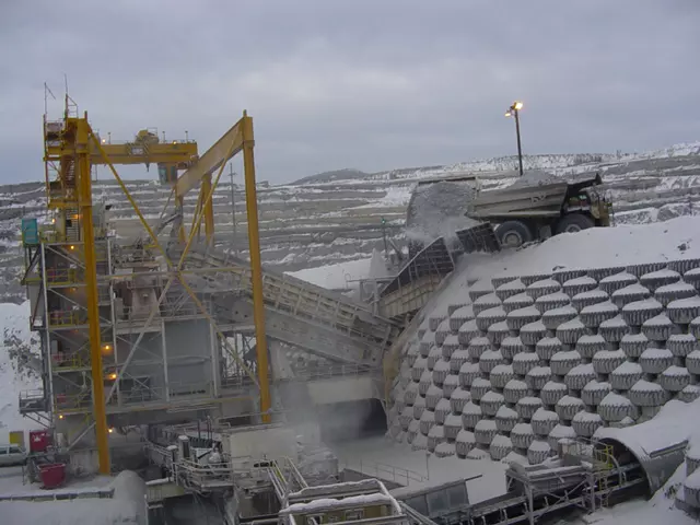 A haul truck dumping ore into a gyratory crusher.