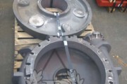 Miscellaneous chrome white iron pump parts including casings, suction liner and impellers.